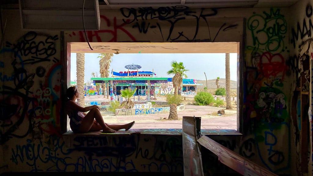 Rock a Hoola Waterpark remains nomadicated sitting in window looking out onto the california desert
