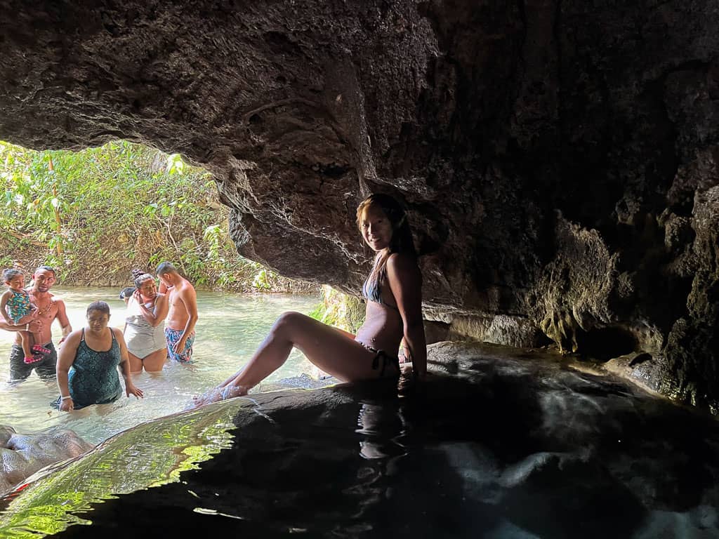Gril in Copalitilla Magic Waterfalls Cave with Tourists behind at 