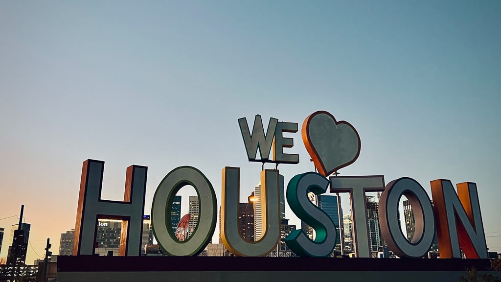 Giant sign with the backdrop of Houston