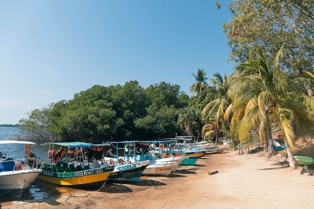 Colorful boats on Laguna de Manialtepec lagoon beach