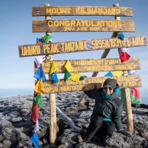 catherine xu on top of kilimanjaro