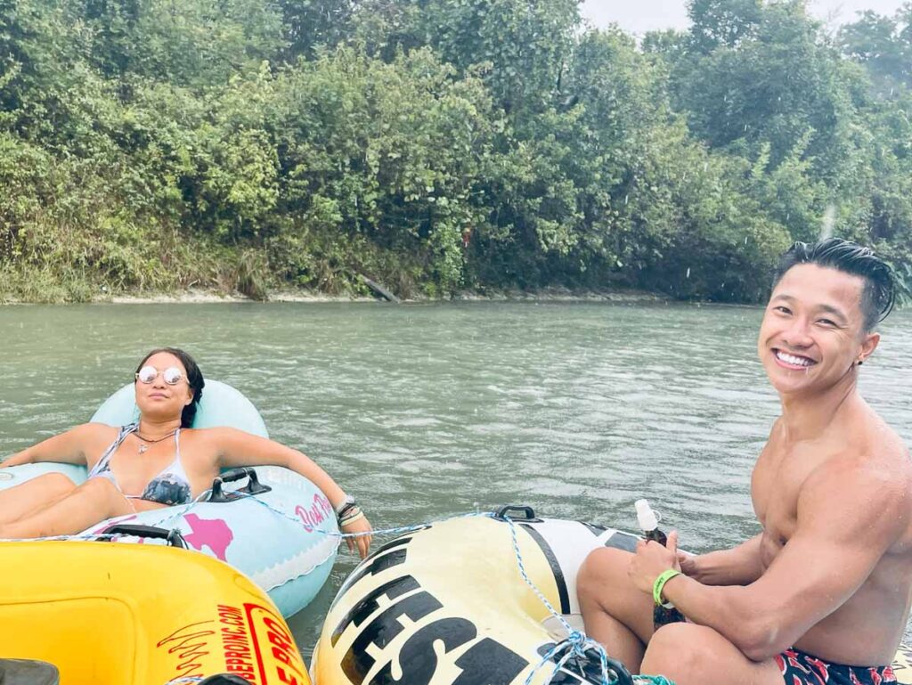 trying to enjoy the river float as it thunderstorms pouring down rain