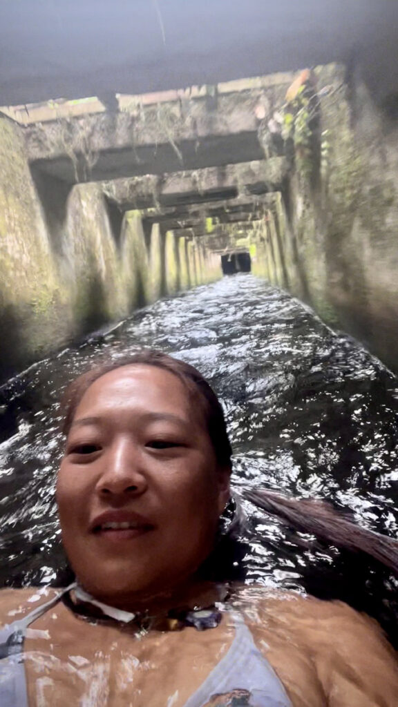 nomadictaed sliding down bridge drain, one of the funnest things to do in lombok