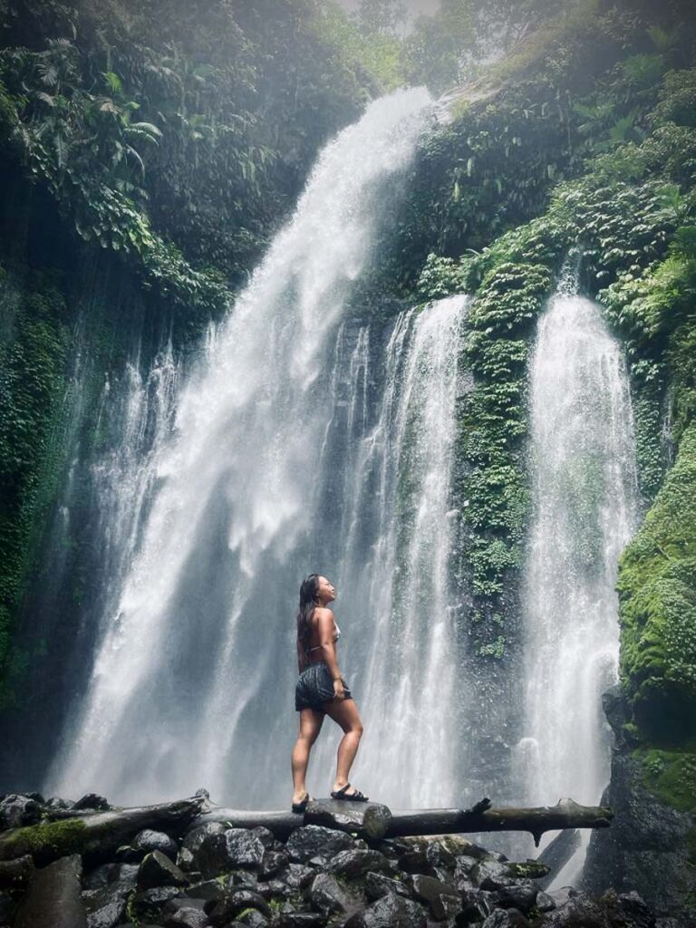 nomadicated standing in fron of tiu kelep the waterfall that makes lombok worth going to