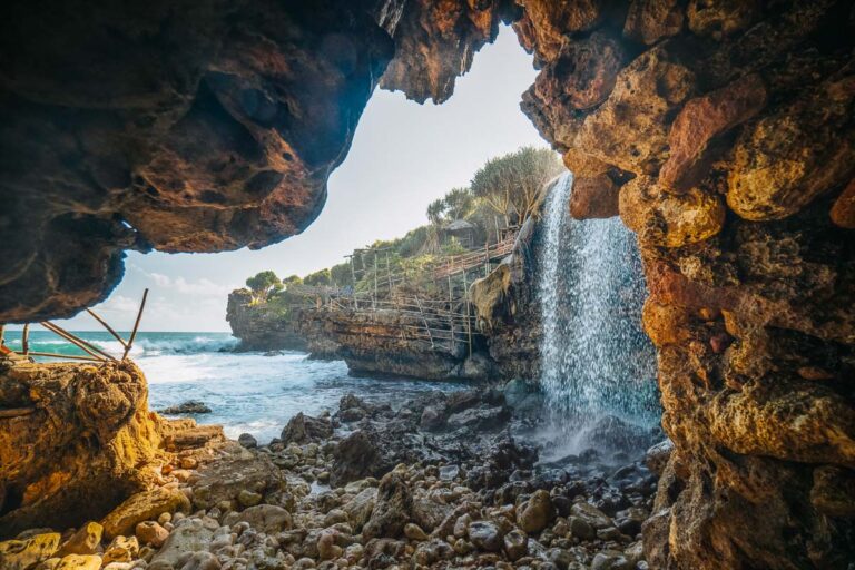 jogan beach, a yogyakarta beach where a freshwater waterfall flows into the sea