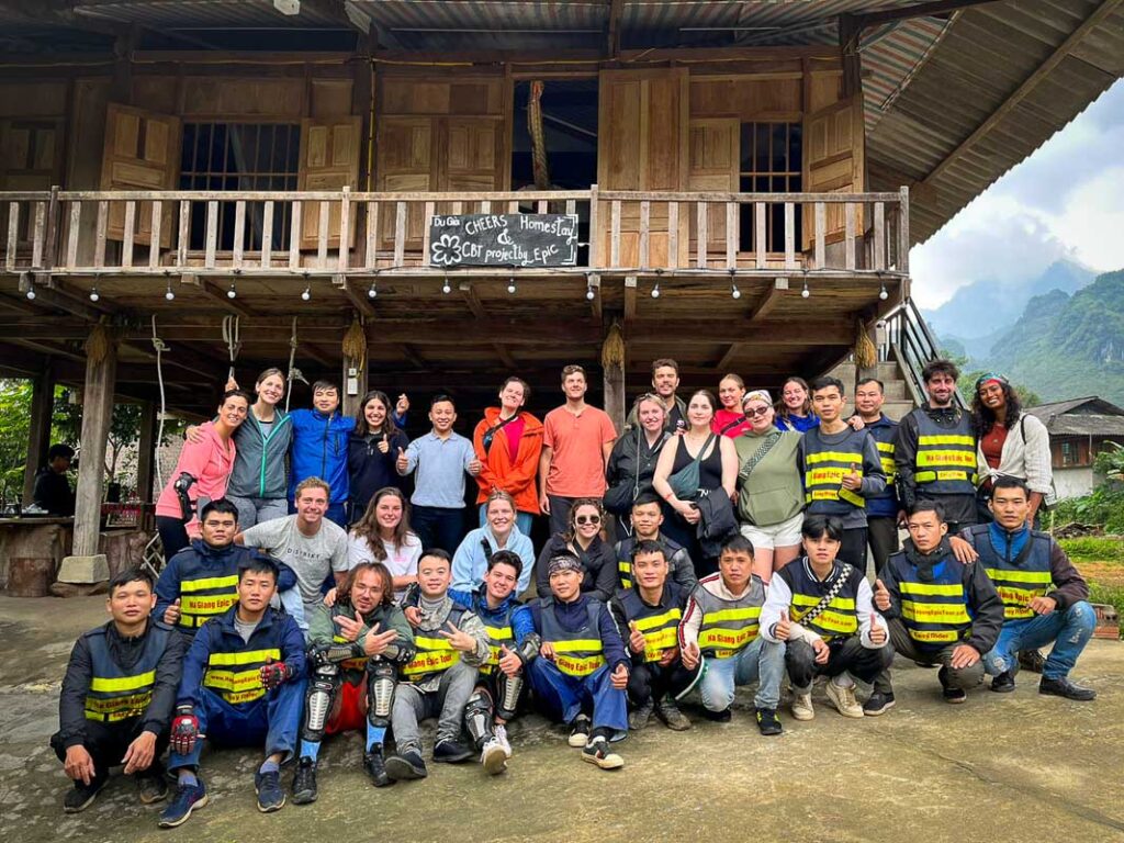 Ha Giang Loop Tour by Cheers Hostel group photo in front of du gia local homestay