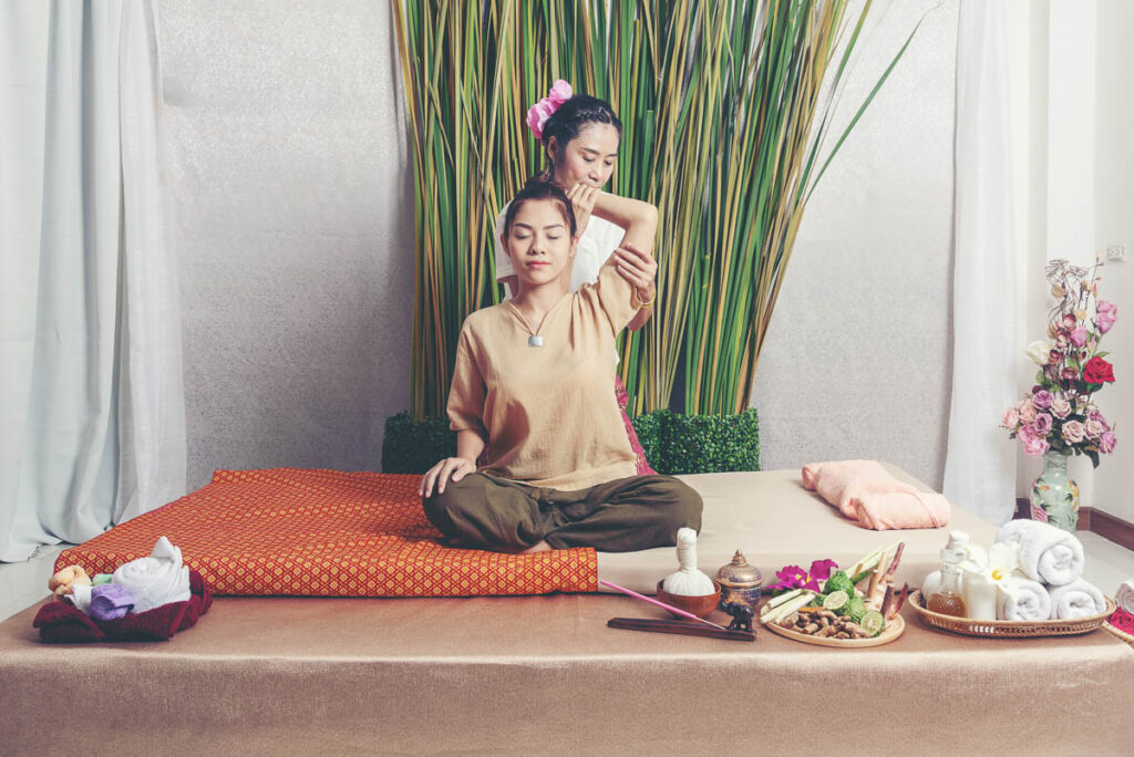 Thai Masseuse doing massage for lifestyle woman in spa salon. Find out all the prices of massages in thailand on the menu