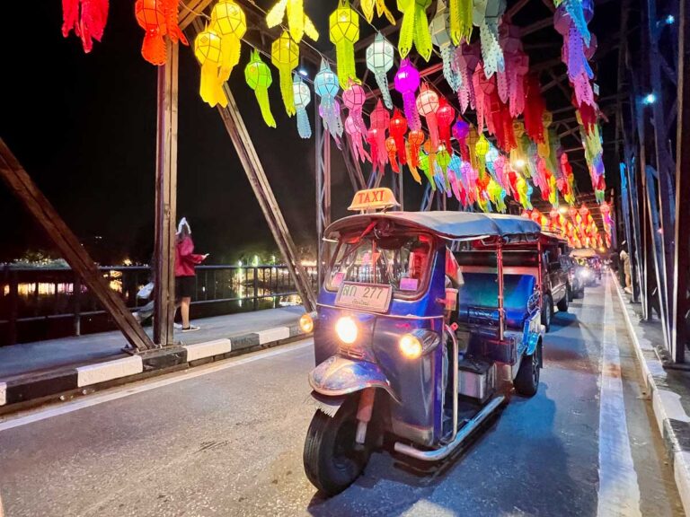 Tuk tuk driving on the bridge in Chiang Mai