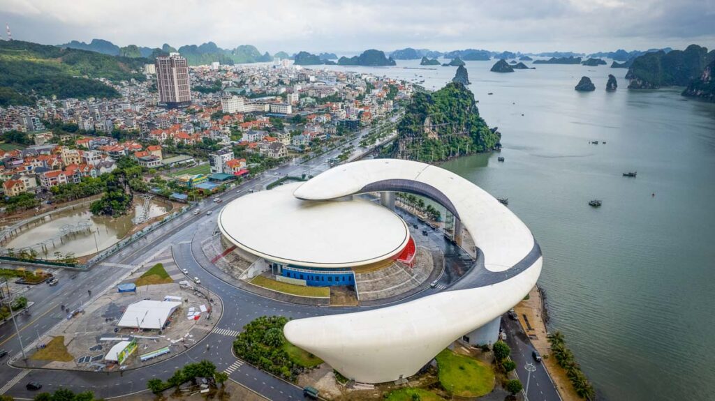 ha long bay convention center with karsts in the background, a must on a north vietnam itinerary