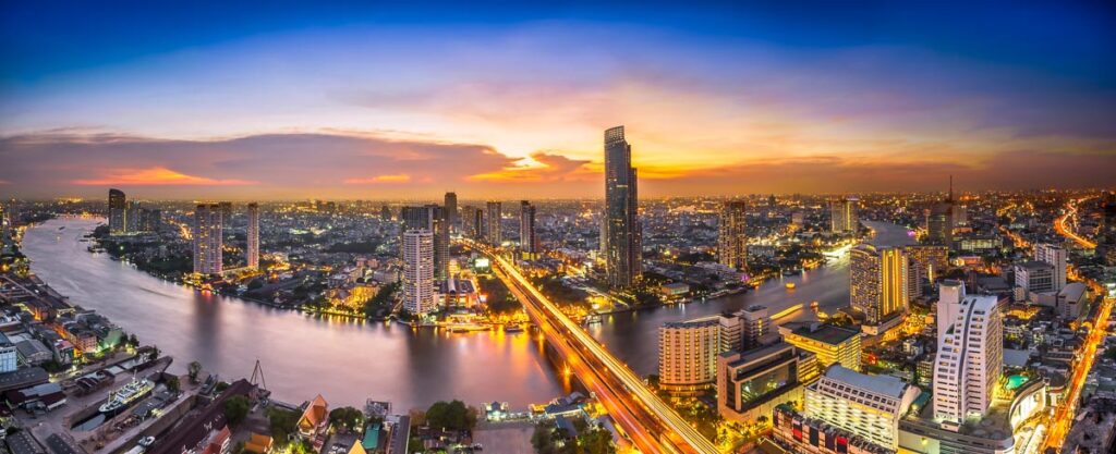 Skyscraper on night scene cityscape at Chaopraya river in Bangkok metropolis Thailand
