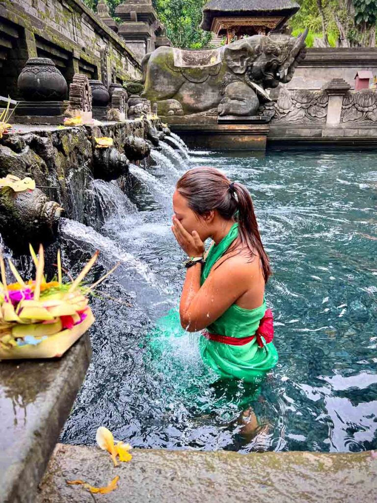 bathing in the holy waters of Pura Titra Empul is a bali bucket list thing to do