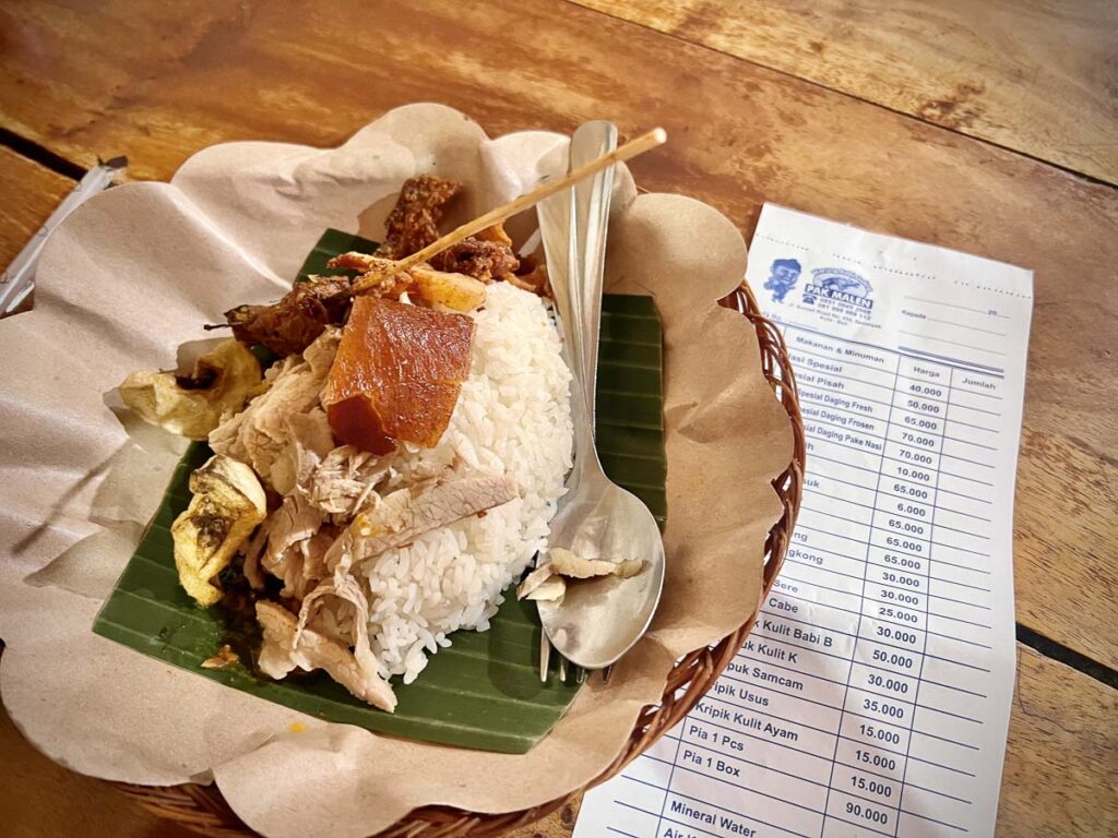 babi guling, one of the most famous cuisines to eat in bali