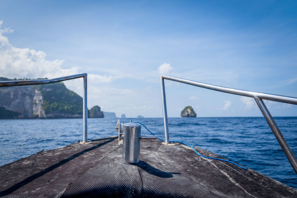 nusa penida cliffsides and banah cliff archway from boat