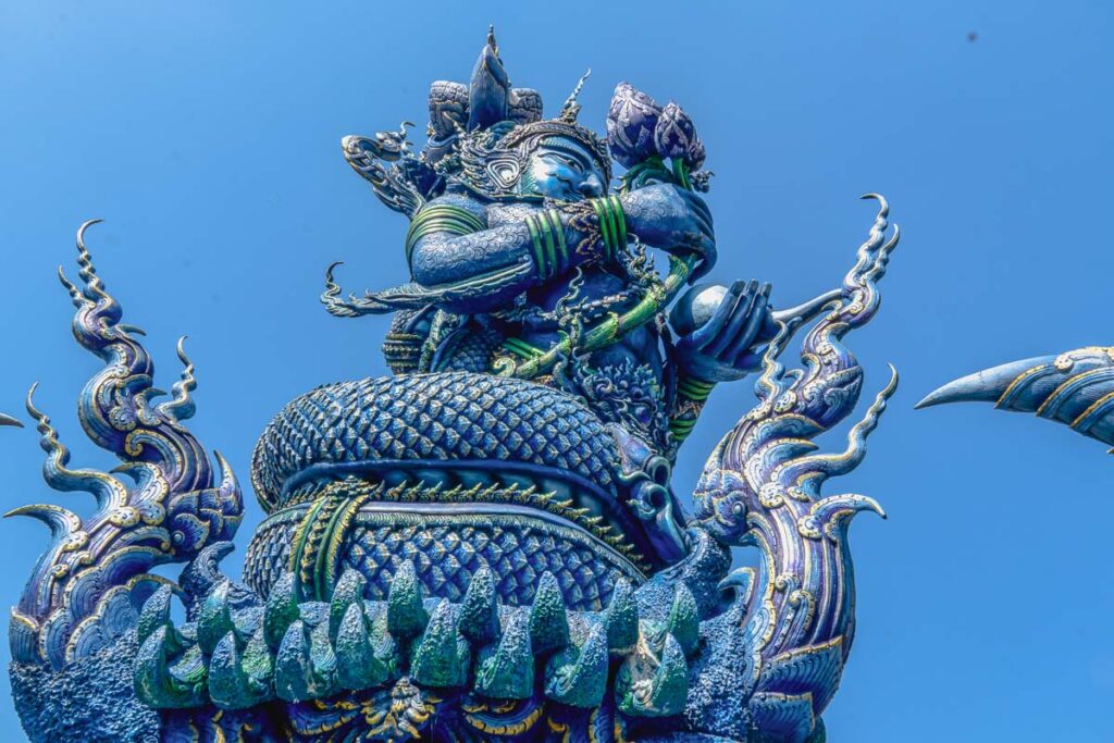 blue temple chiang rai mythological creature statues