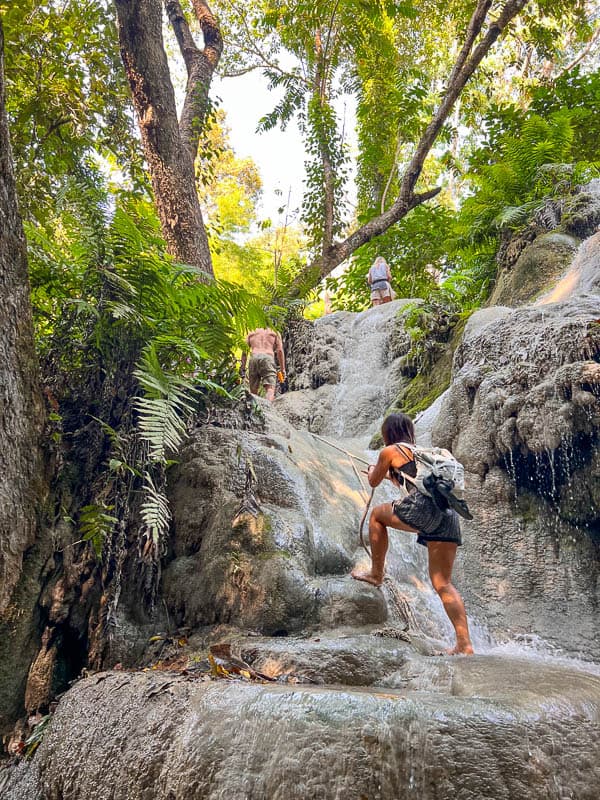 nomadicated climbing up the bua tong sticky waterfalls near chiang mai