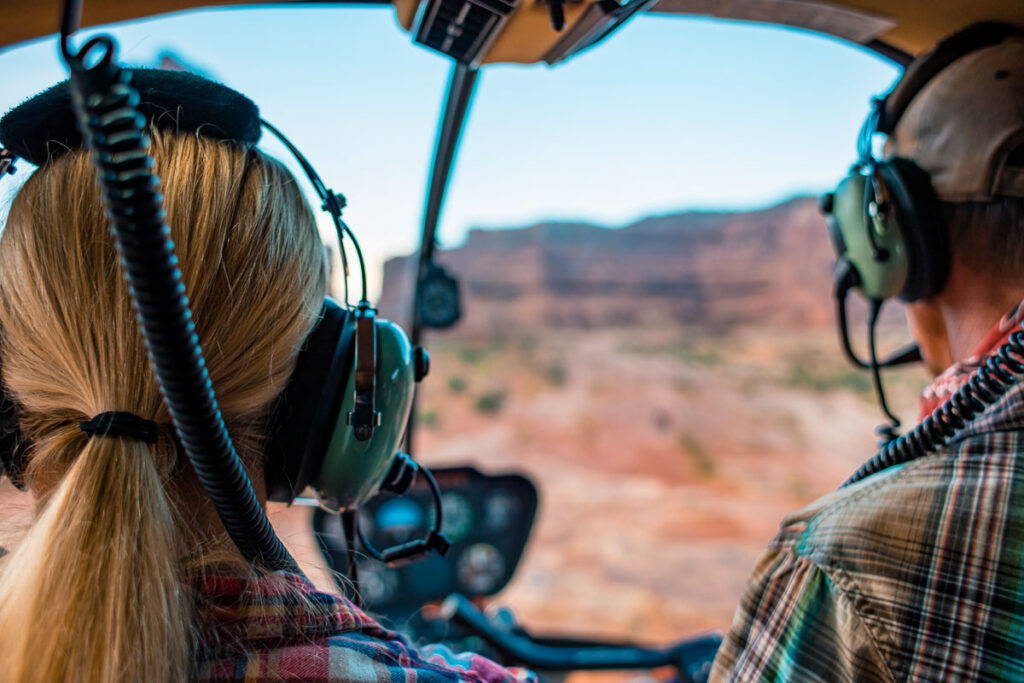 Woman Taking A Helicopter Hiking Tour In The Remote Deserts of Grand Canyon