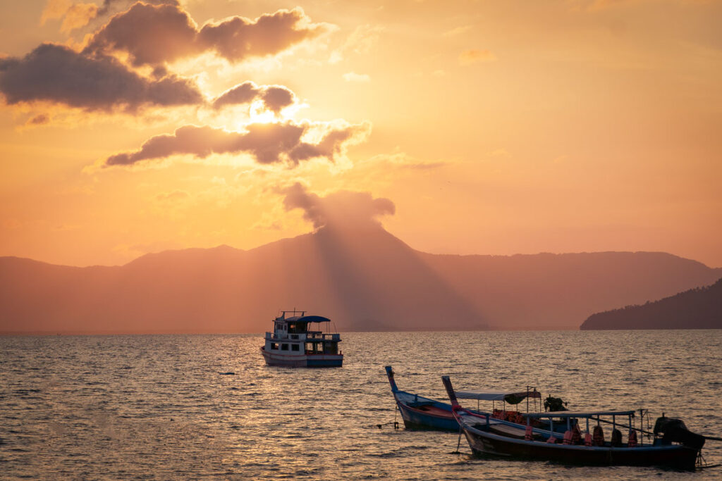 Traditional longtail boats anchored at the pier