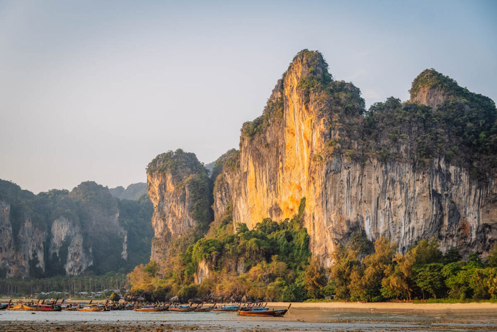 A shot of railay beaches limestone cliffs during golden hour, one of thailand's most impressive natural landmarks