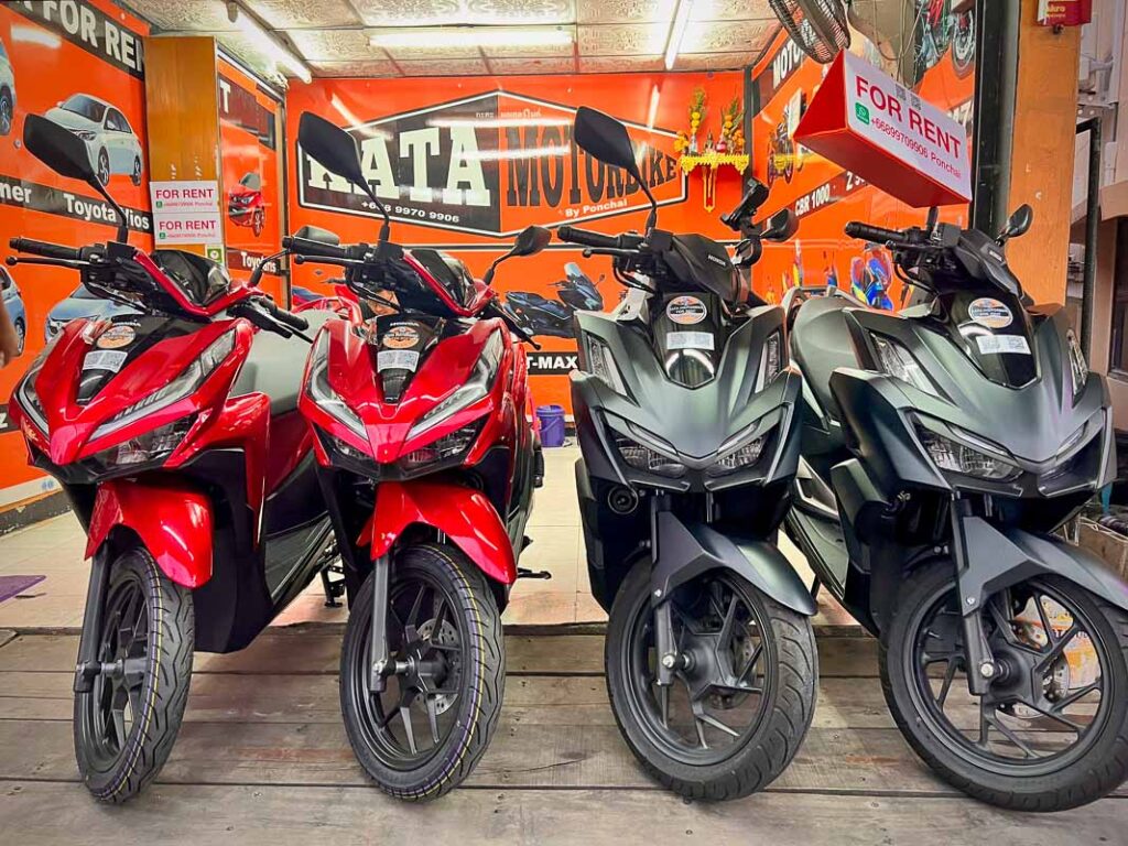 four bikes in front of a motorbike rental shop in phuket