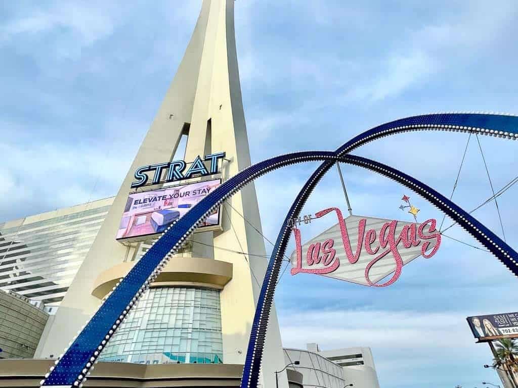 the strat and the las vegas iconic sign