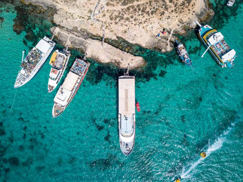 birds eye view of the boats of blue lagoon in comino island