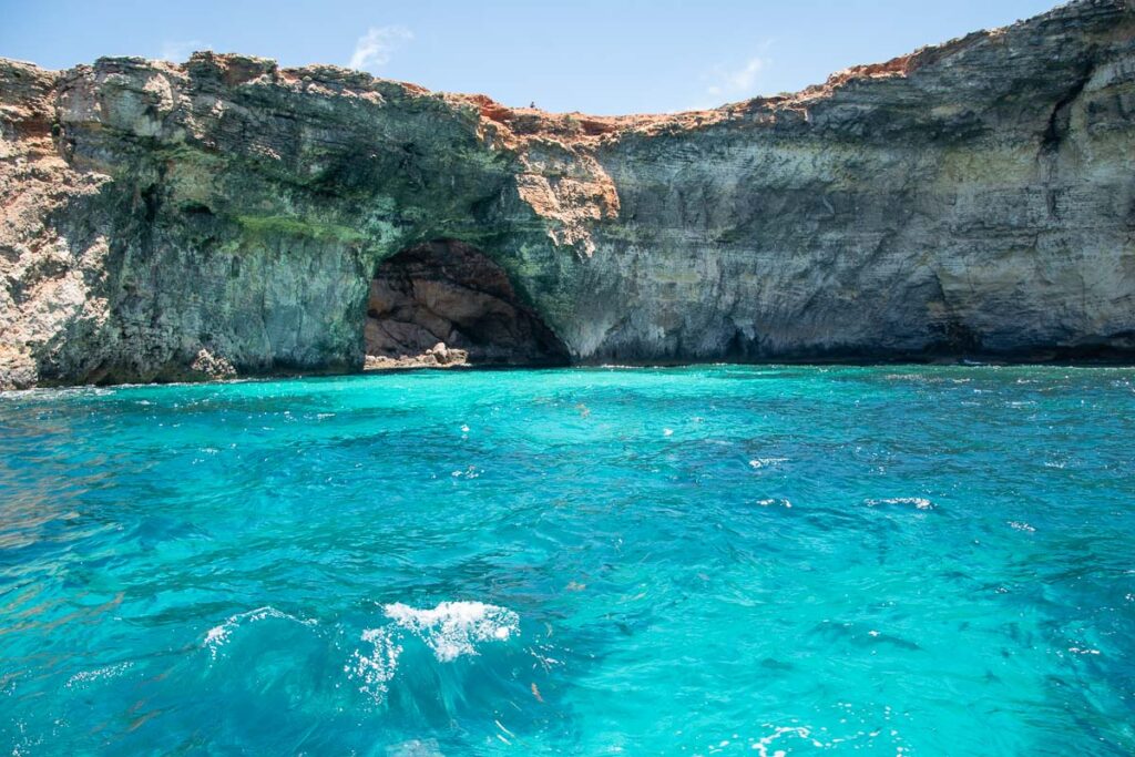 sea cave system of comino with turquoise water