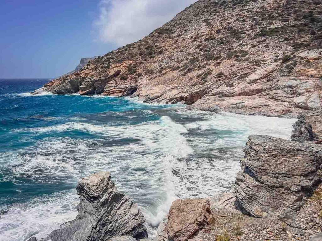 The breathtaking cliffs and caves of Mouros Beach on a wavy day