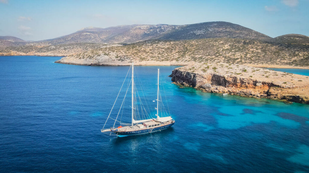 big sailboat on the coast of amorgos island, greece