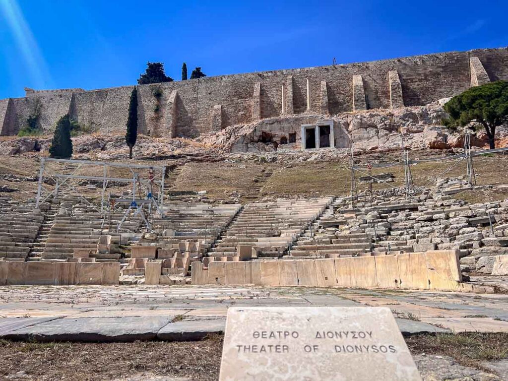 view from the front of the Theatre of Dionysus including the sign