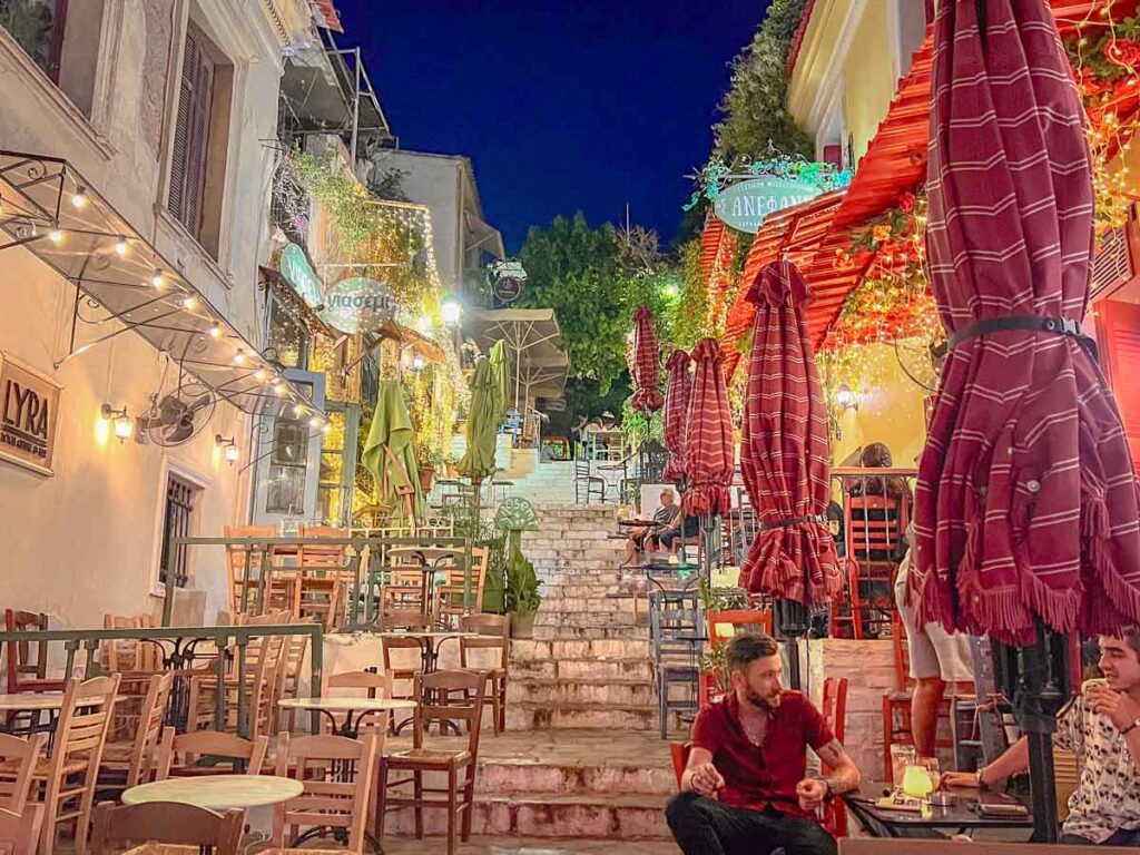 famous restaurant street on a nighttime food tour in athens