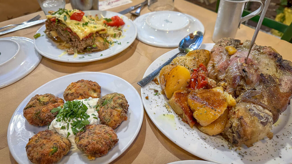 zucchini balls and braised pork knuckle as a traditional food of greece