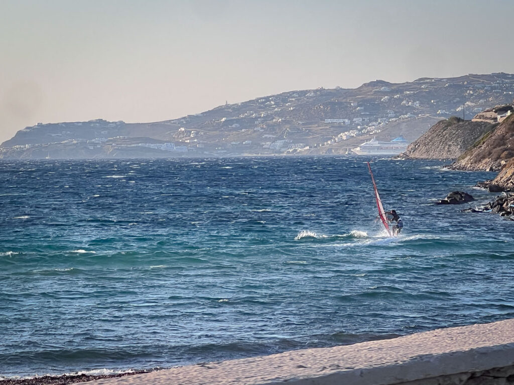 kitesurfing by ornos beach in mykonos island greece