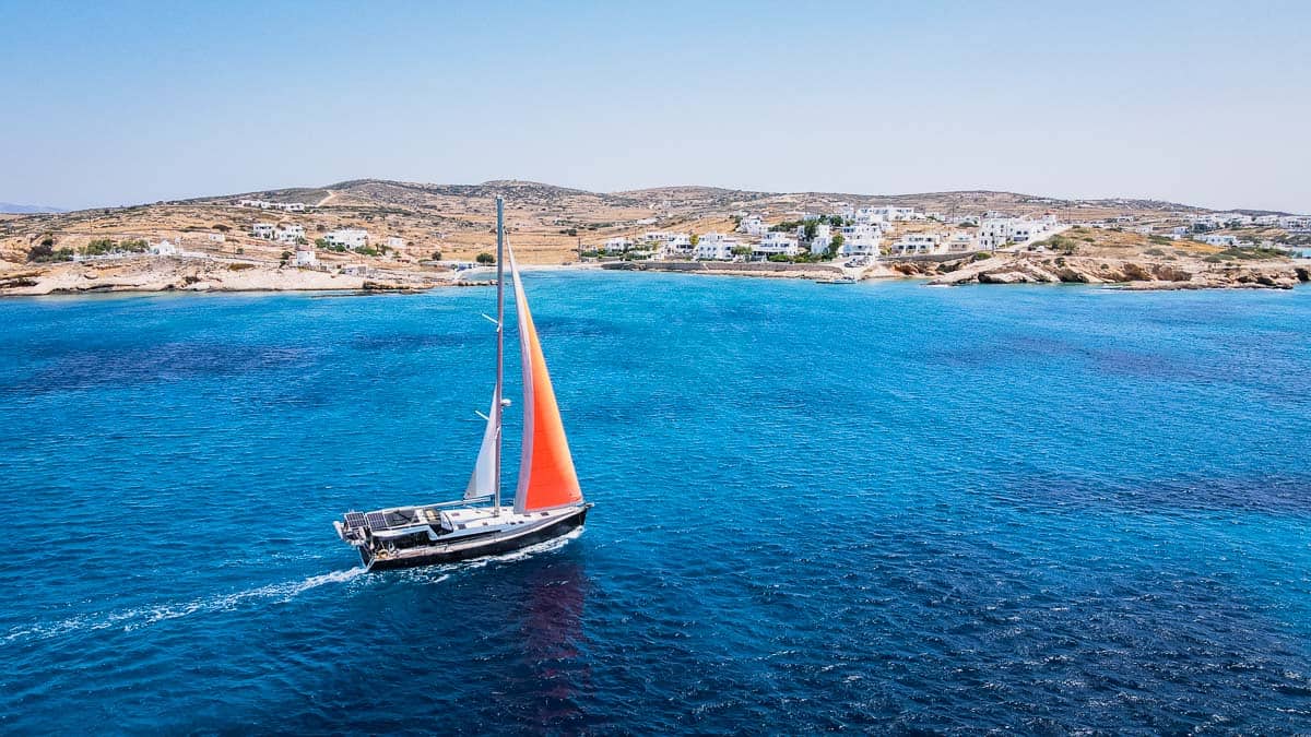 sailboat sailing in front of chora Koufonisia island