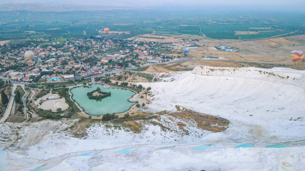 Bright white terraces stretching across the hillside of Pamukkale