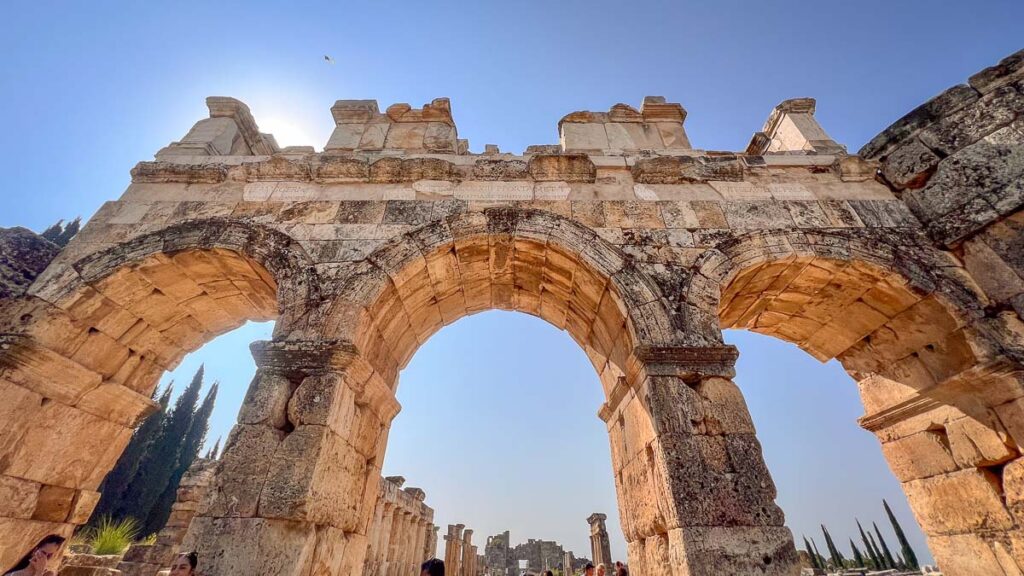 The ruined archways of Hierapolis, providing glimpses of the city's former grandeur