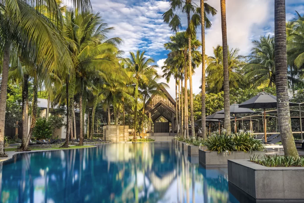 twinpalms phuket exterior pool view lined with palm trees