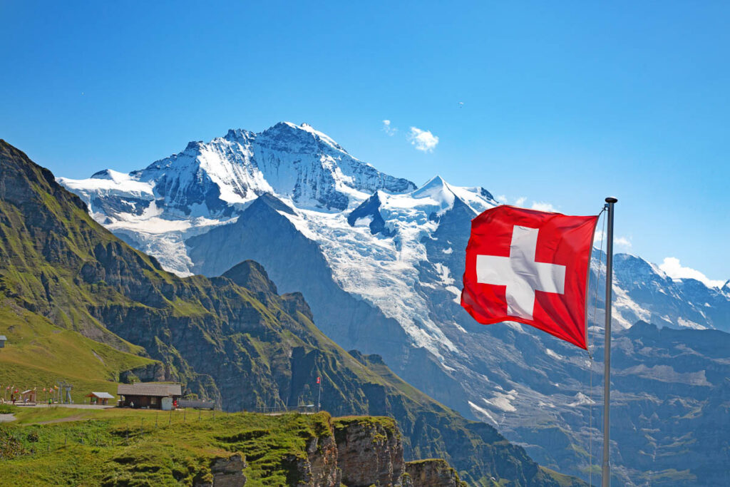 Swiss flag on the top of Mannlichen (Jungfrau region, Bern, Switzerland)