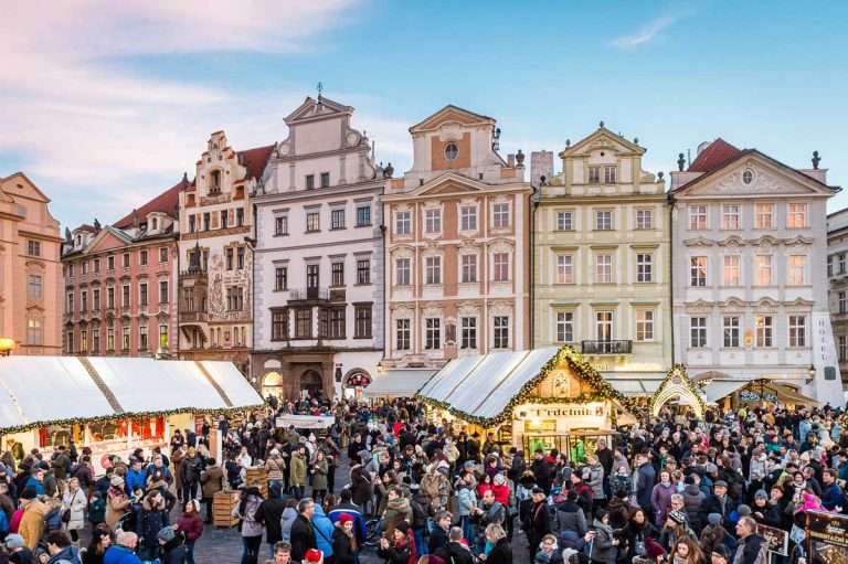 Czech Republic, Prague, Old Town Square, historic pastel-colored Baroque and Gothic townhouses