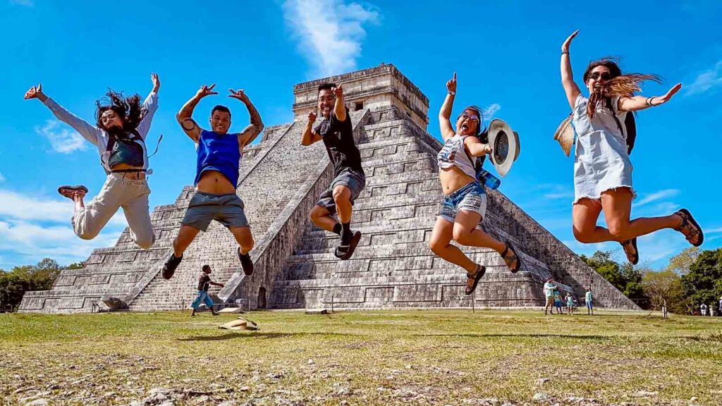 Mexico, Chichen Itza Ruins Friends Cat and friends Jumping