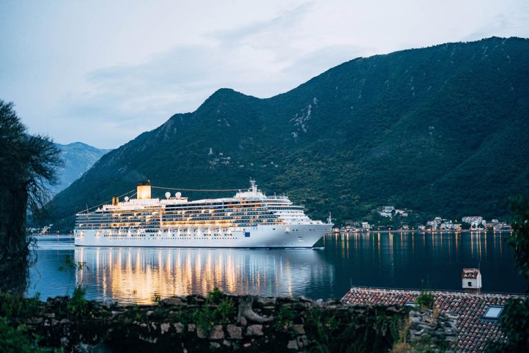 The cruise liner sails at night on the Gulf of Kotor in Montenegro, near Perast. High quality photo