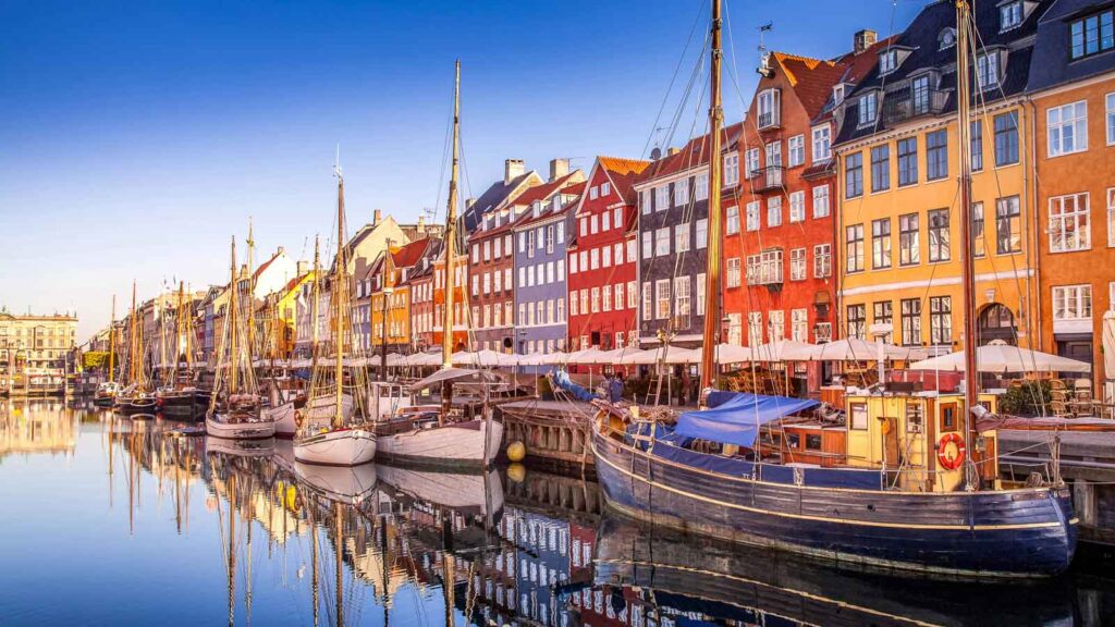 Denmark, Copenhagen Boat with Old Buildings