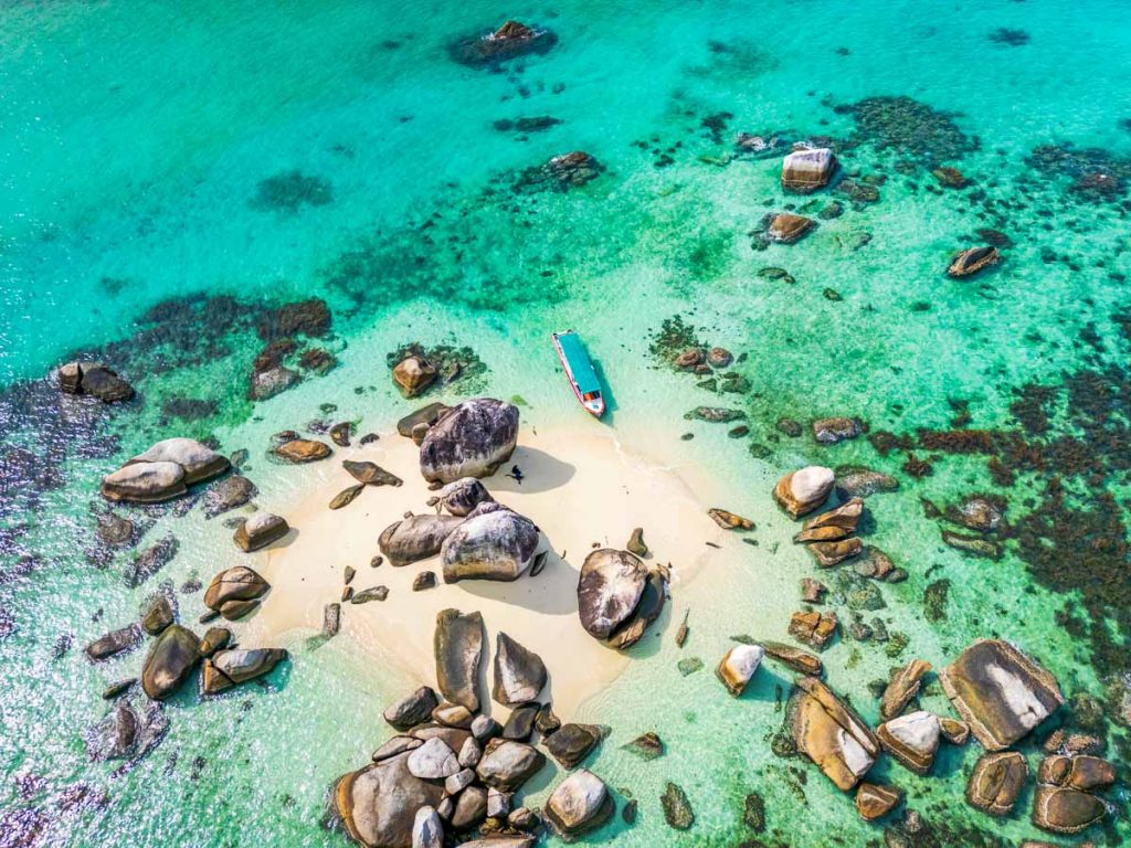 Belitung beach and islands drone view. Beautiful aerial view of islands, boat, sea and rocks in Belitung, Indonesia