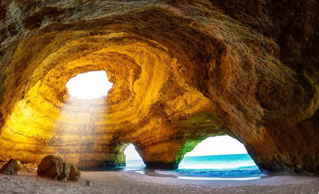Portugal, Algarve, Benagil Cave near Lagos with sunlight through ceiling opening