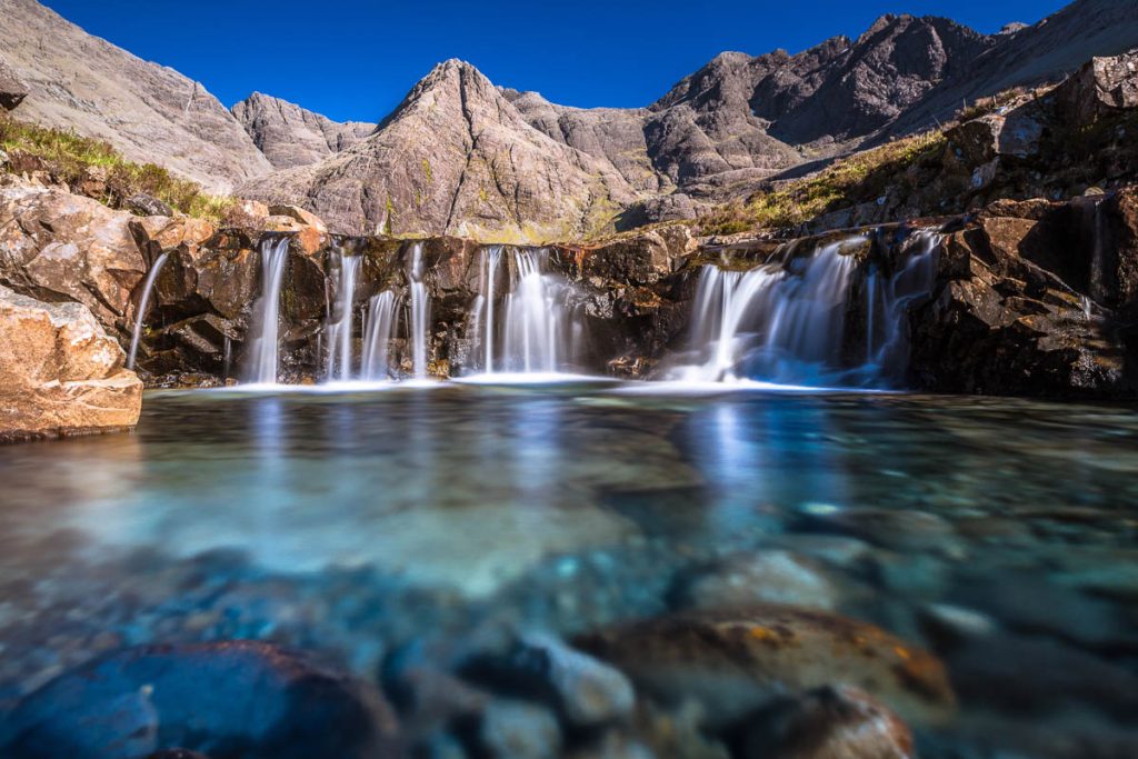 Scotland, Isle of Skye, Fairy Pools waterfalls with turquoise water in summer