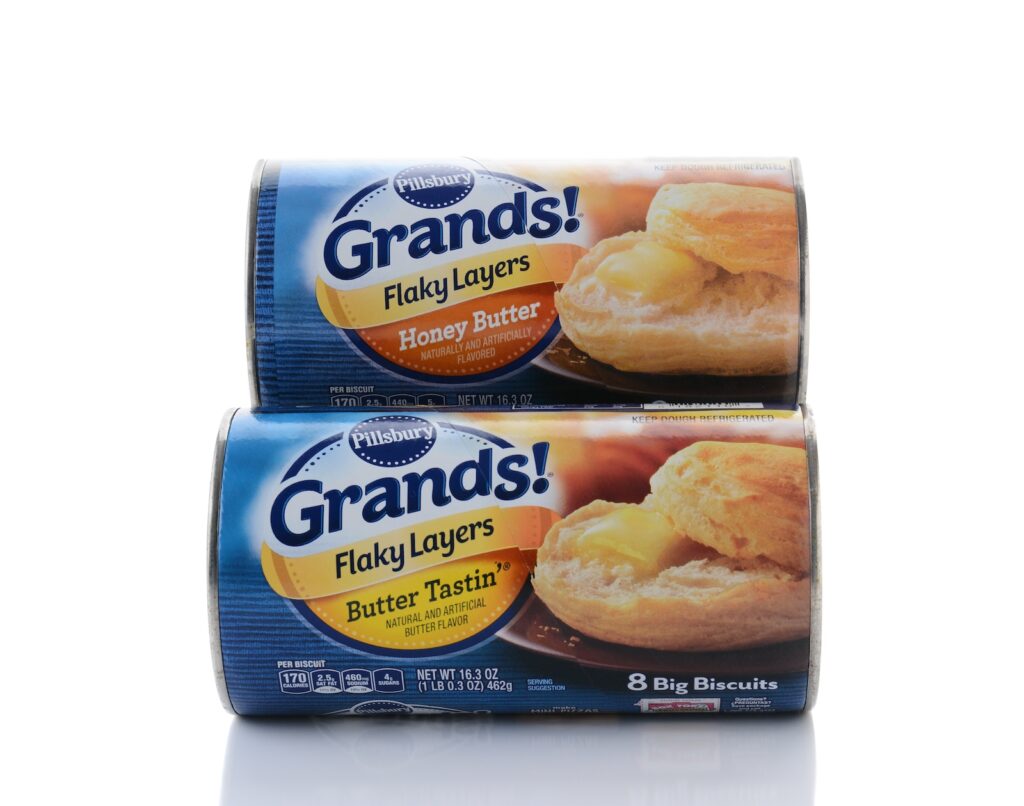 Two cans of Pillsbury Grands Biscuits. A line of refrigerated ready to bake doughs from General Mills.