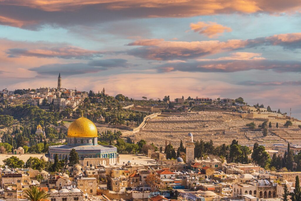 The Dome of the Rock seen from inside Old town, muslim quarter at sunset