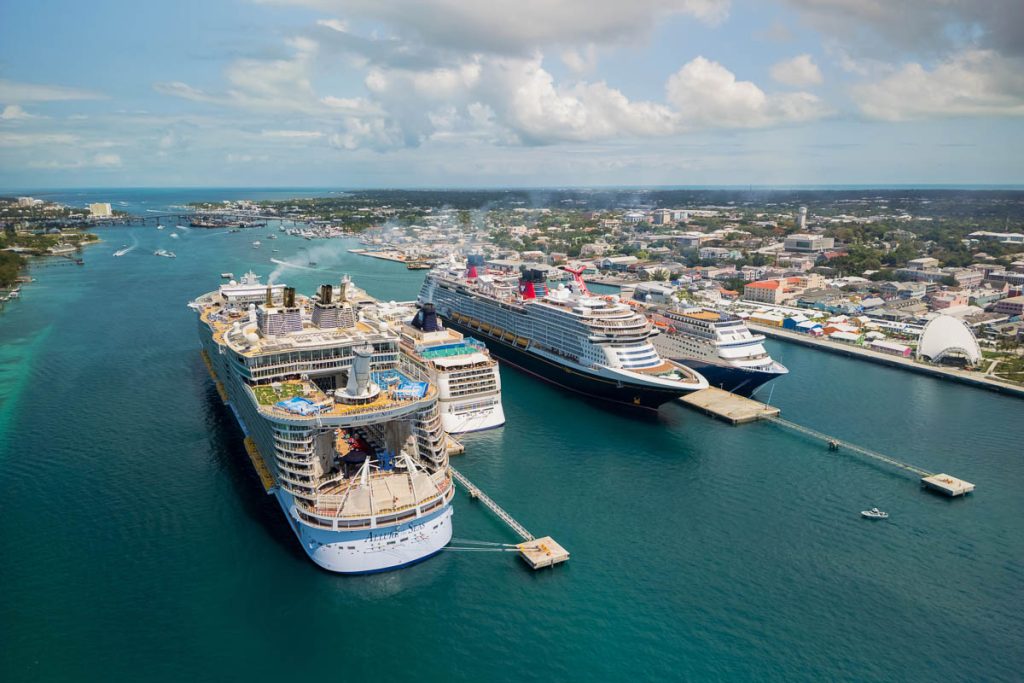Four different luxury cruise ships docked at the Port of Nassau in Bahamas, famous travel destination.